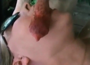 She is lying and sucking a doggy