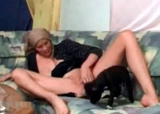 Petite puppy licks a wide muff