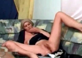 Petite puppy licks a wide muff