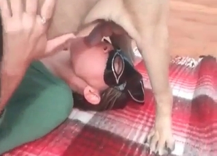 Masked lass and her playful dog