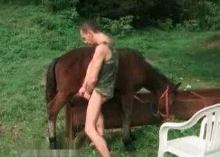 Zoophile rubs his hard dick