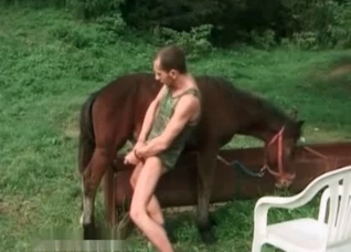 Zoophile rubs his hard dick
