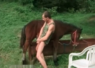 Zoophile rubs his hard dick