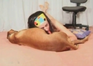 Amateur zoofil sucks a dog dick