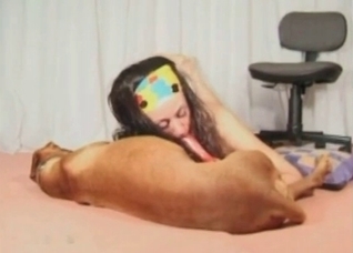 Amateur zoofil sucks a dog dick