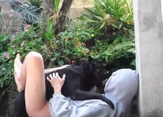Black animal and naked host
